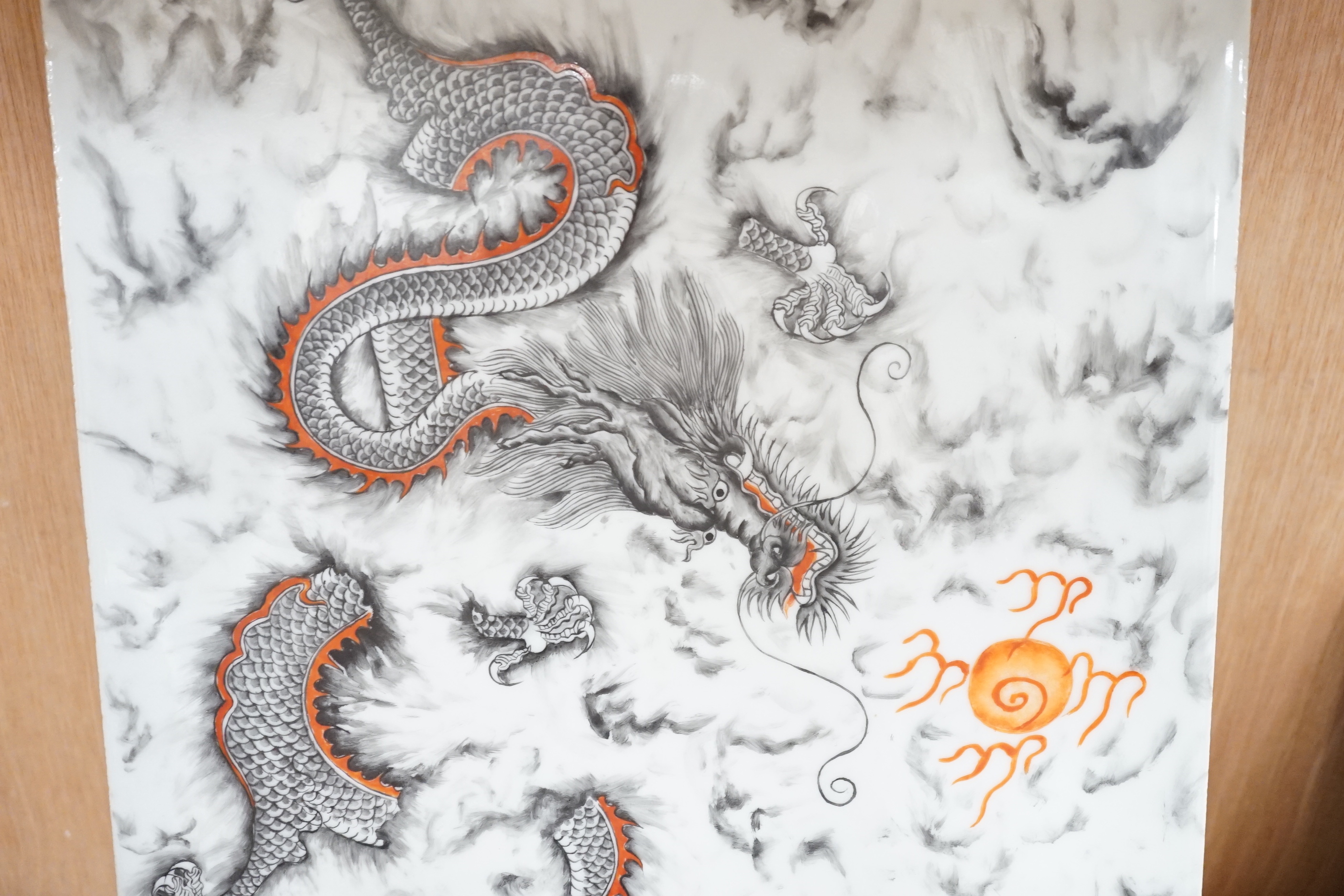 A Chinese porcelain rectangular dragon panel, 42cm x 26cm